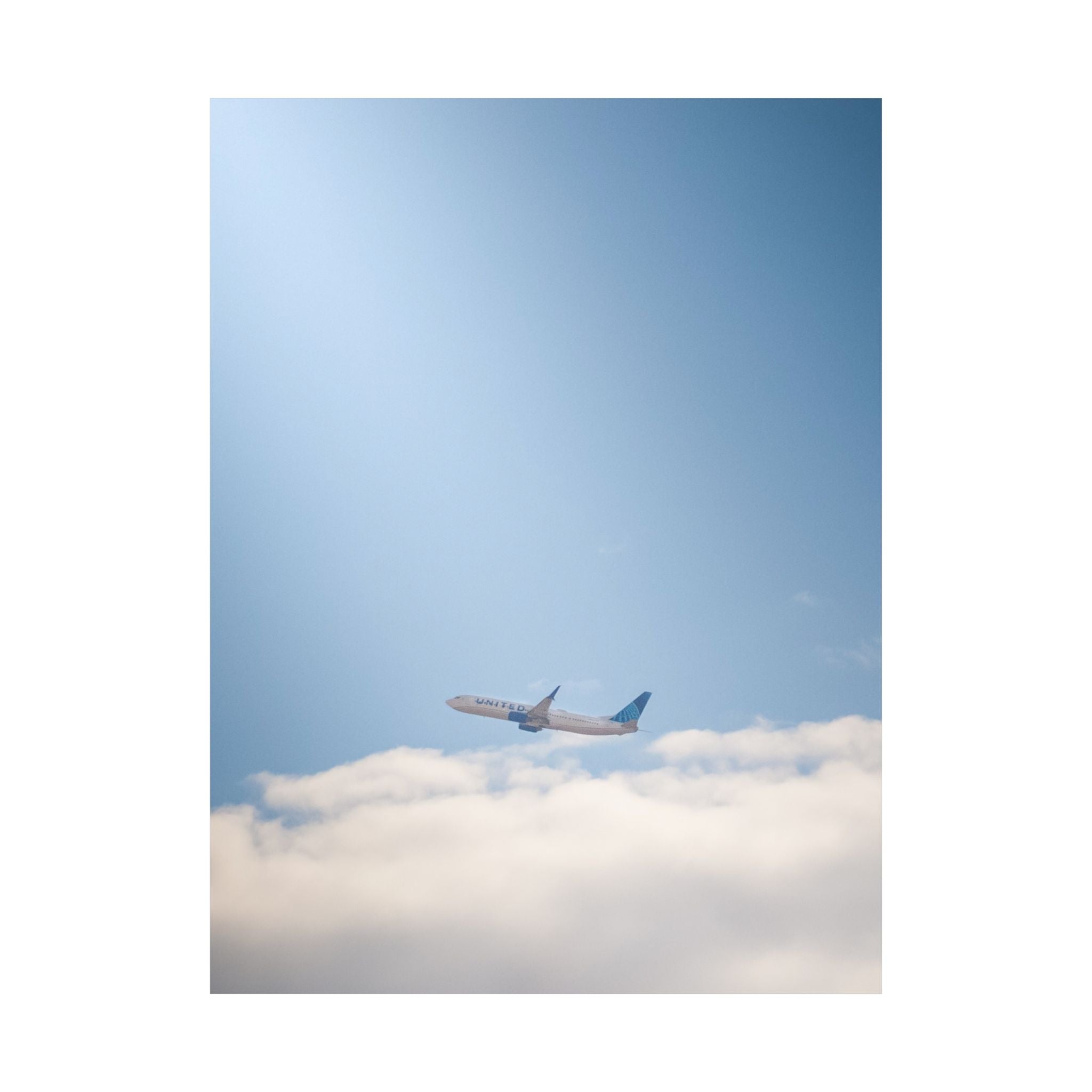 Airplane in Blue Sky Matte Poster — Vertical Travel Wall Art