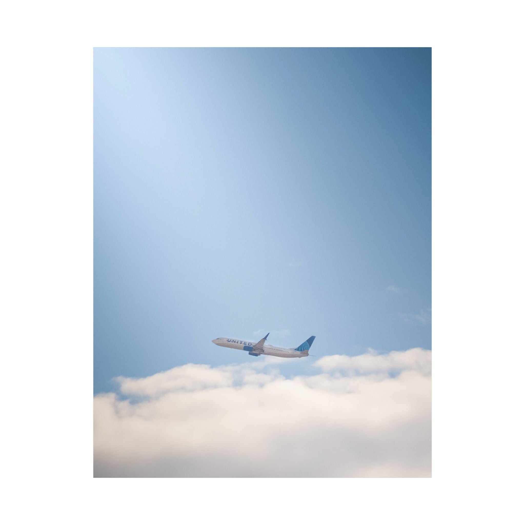 Airplane in Blue Sky Matte Poster — Vertical Travel Wall Art